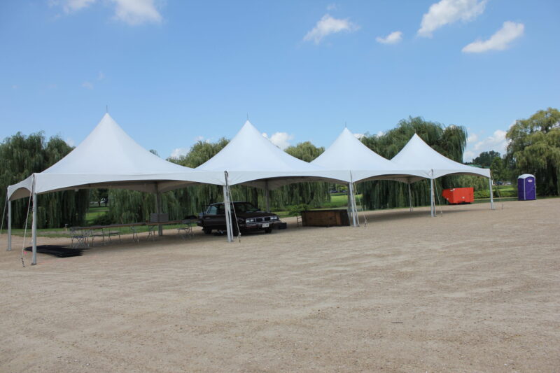 a group of tents in a dirt area